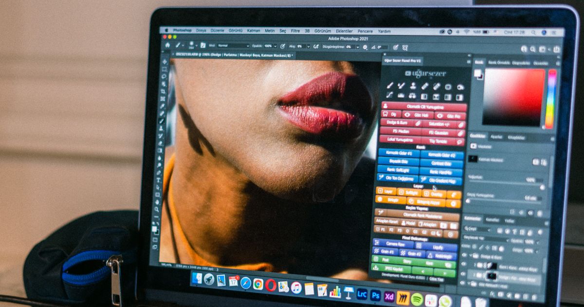 A laptop displaying graphic design software