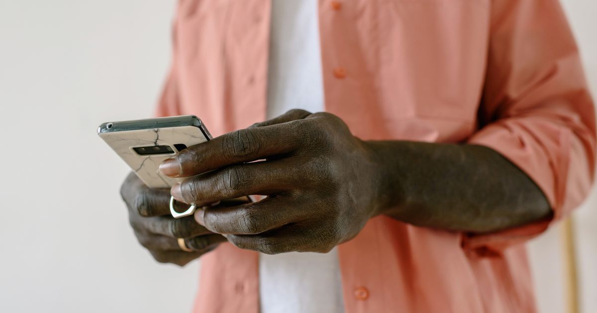 A person using a smartphone indoors